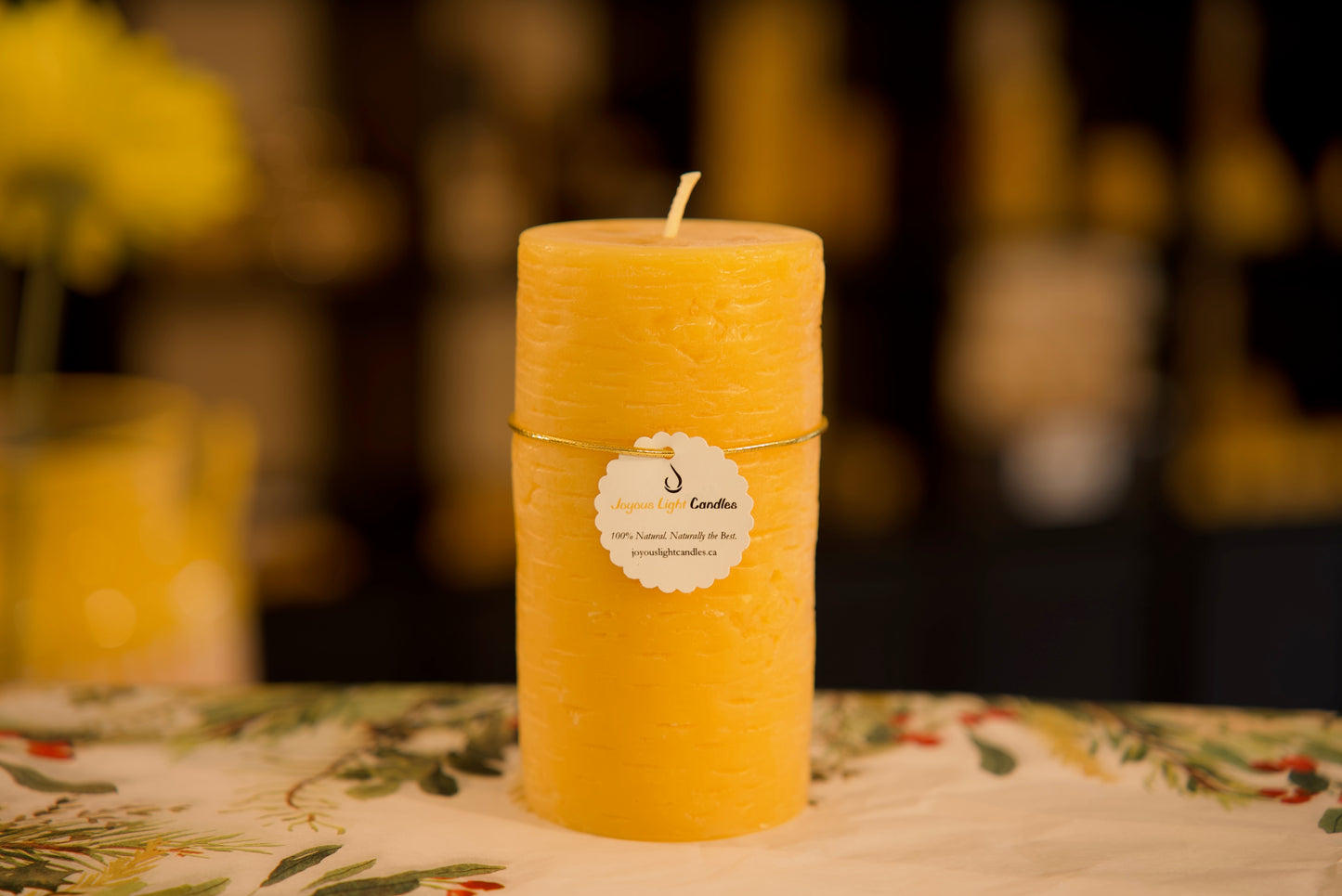 Handcrafted pure beeswax pillar candle with a birch bark texture, eco-friendly, 2.75x5.5 inches.
