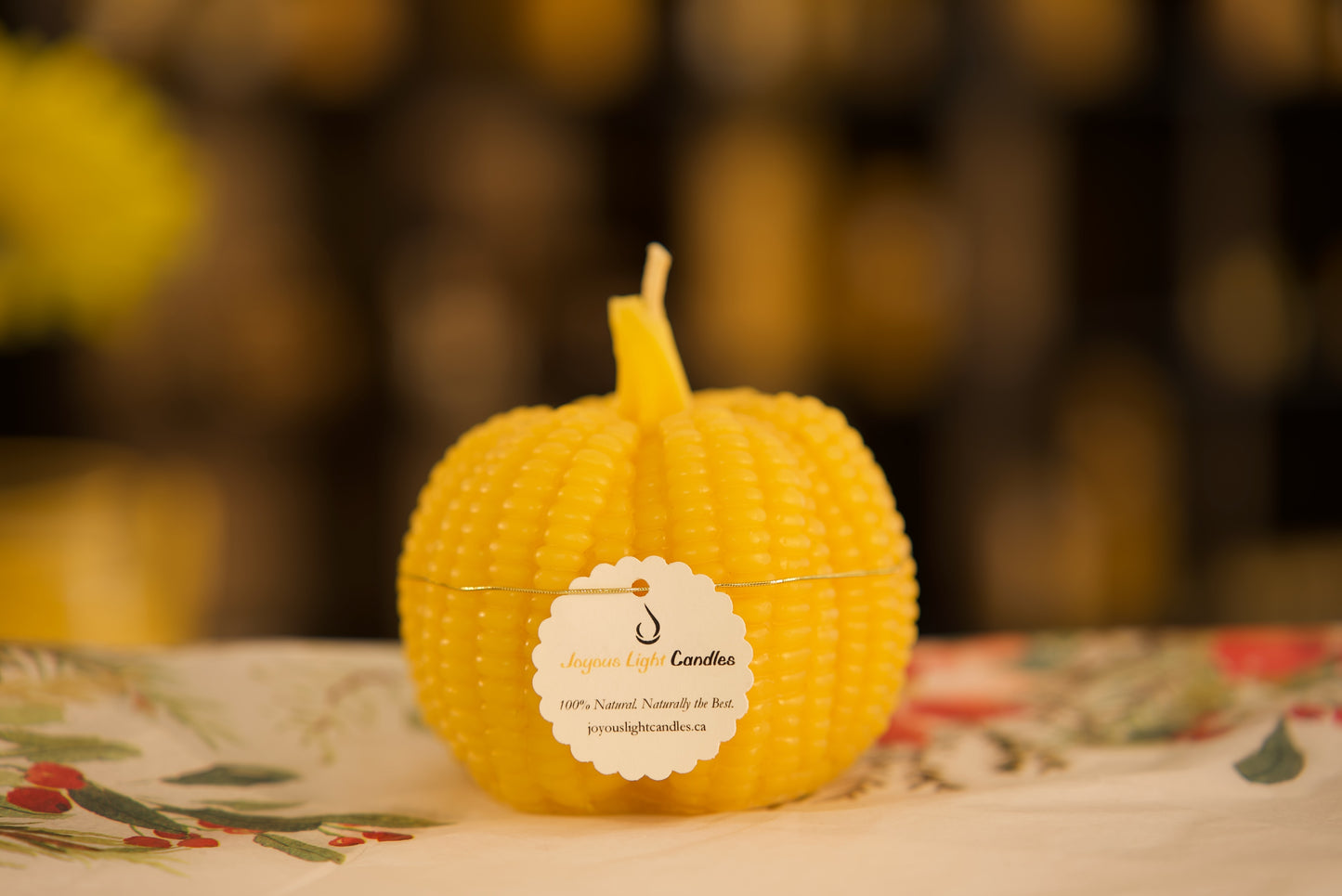 Autumn-themed beeswax candle featuring pumpkin and cornstalk design, 3.5x3.75 inches