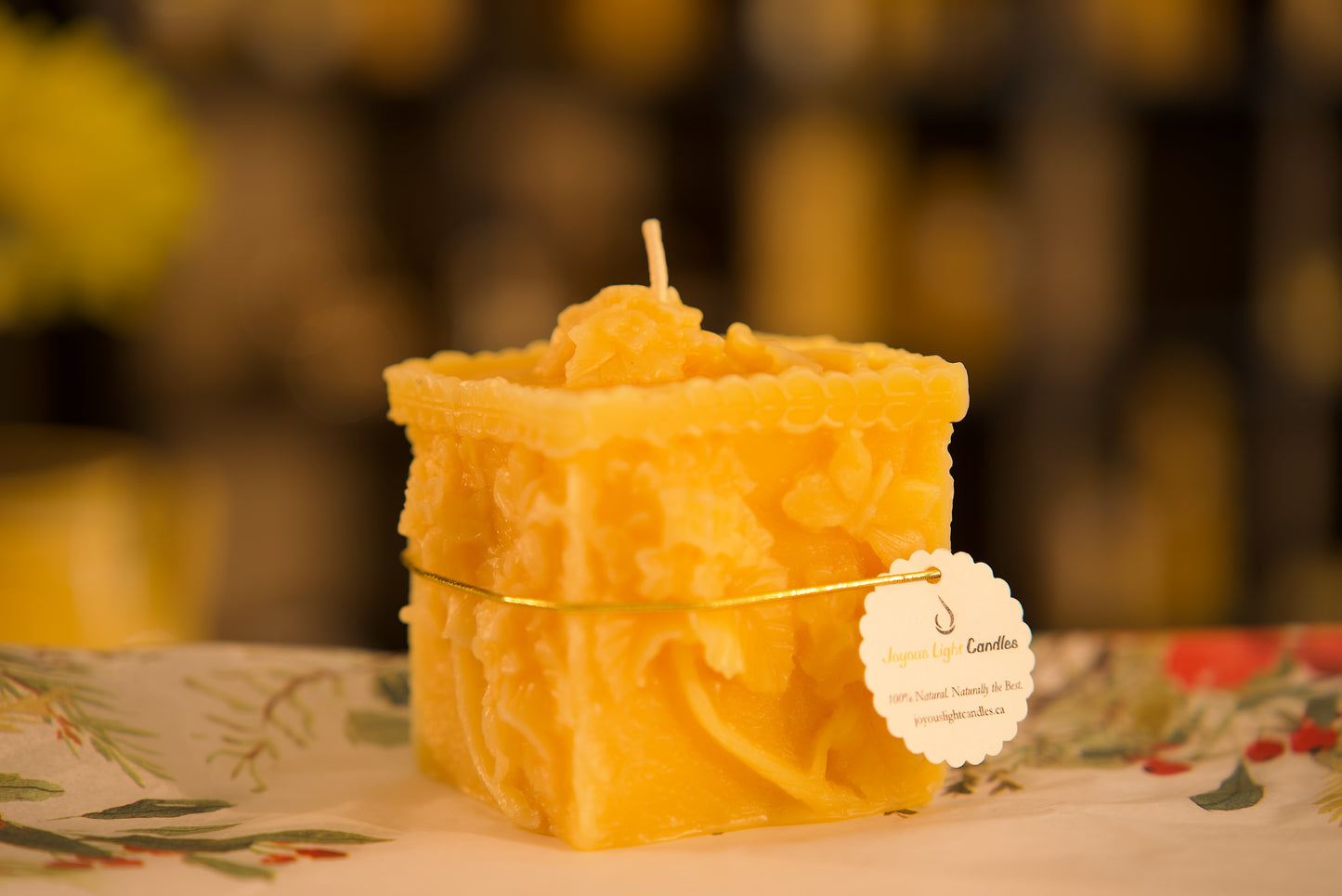 Square eco-friendly beeswax pillar with dancing butterflies and blooms, 3x3.25 inches