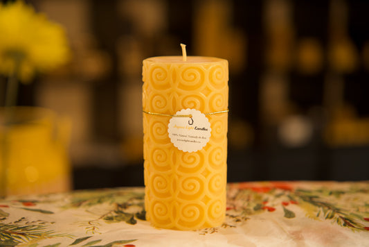 Whimsical swirling patterns adorn this pure beeswax pillar, sustainable, 2.75x5.5 inches