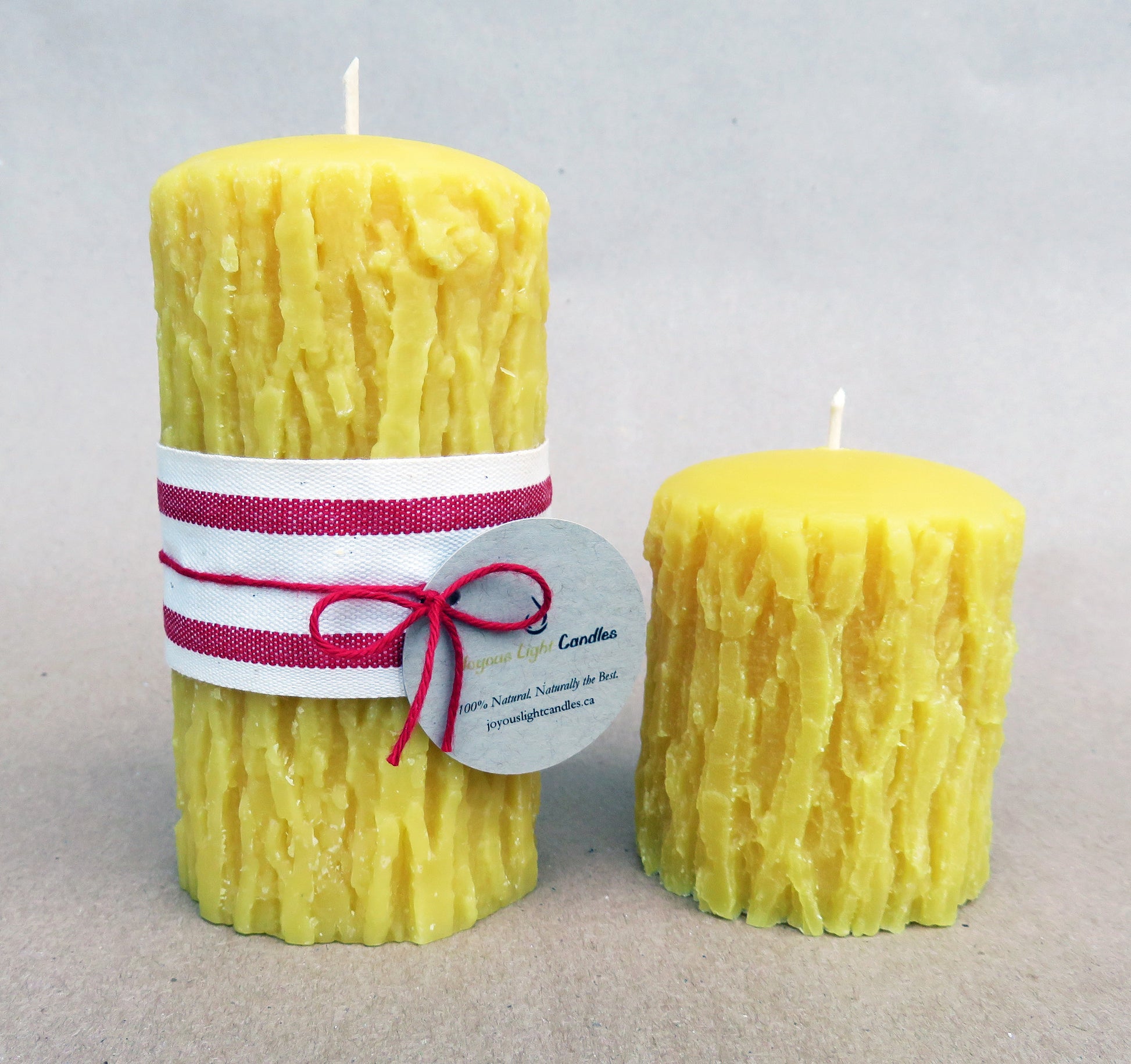 Rustic pure beeswax pillar with authentic bark texture, tall woodland decor, 2.75x5 inches
